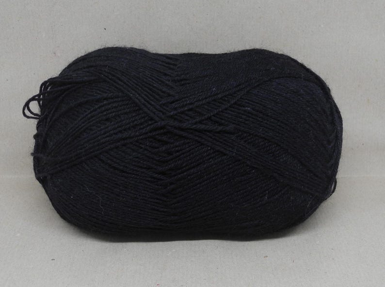 May include: A ball of black yarn.