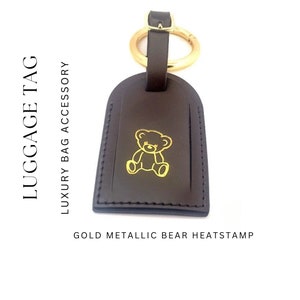 Louis Vuitton luggage tag black Golden Leather ref.359739 - Joli