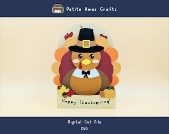 May include: A Thanksgiving-themed papercraft featuring a cartoon turkey wearing a pilgrim hat and bow tie. The turkey has a colorful tail and is set against a light background. The words "Happy Thanksgiving!" are printed on the base.