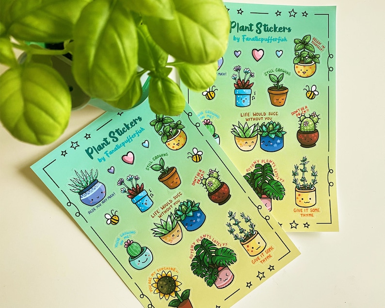 May include: Two sheets of plant stickers with a gradient background. The stickers feature illustrations of potted plants with cute faces and sayings like "Still Growing" and "Life Would Suck Without You".