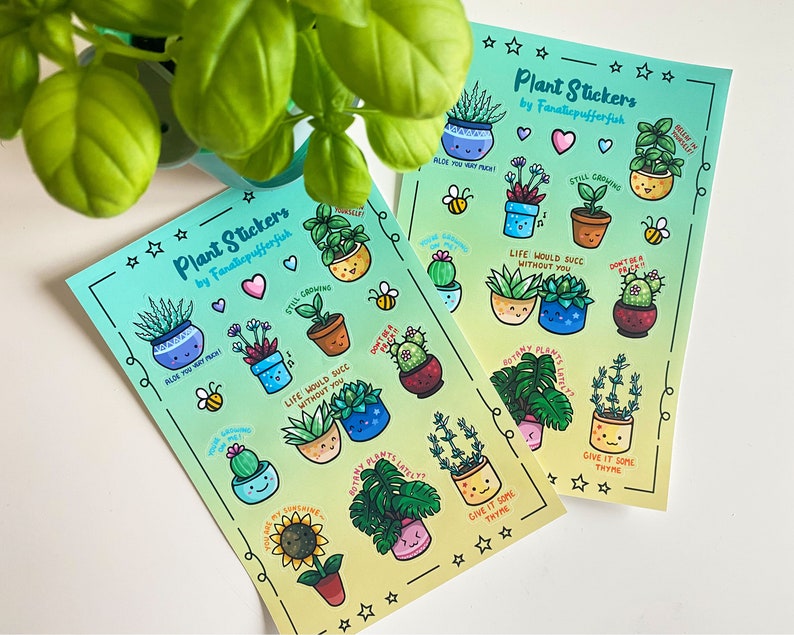 May include: Two sheets of stickers featuring illustrations of potted plants with cute faces and puns. The stickers are on a light blue and yellow gradient background with white stars and hearts. The text on the stickers reads "Plant Stickers by Fanaticpufferfish", "Aloe You Very Much!" , "Still Growing", "Life Would Suck Without You", "Don't Be A Prick", "Give It Some Thyme", "Botany Plants Lately", "You're My Sunshine", "You're My Sunshine", "Give It Some Thyme", "Don't Be A Prick", "Life Would Suck Without You", "Still Growing", "Aloe You Very Much!" and "Believe In Yourself!"