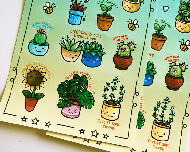 May include: A sheet of colorful stickers featuring various potted plants with cute faces and motivational messages. The stickers have a green and yellow gradient background with white stars.