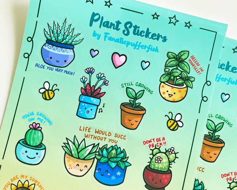 May include: A sheet of colorful plant stickers with various designs and sayings. The stickers feature potted plants with happy faces and motivational phrases like "Aloe You Very Much!" and "Still Growing".