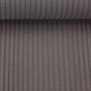 May include: Close-up of a grey ribbed fabric with a subtle texture. The fabric has a vertical ribbed pattern.