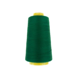 Può includere: Un'bobina di filo verde scuro con una bobina di plastica gialla.