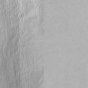 Könnte beinhalten: Nahaufnahme eines hellgrauen, strukturierten Stoffes. Der Stoff hat eine glatte, gleichmäßige Textur auf der rechten Seite des Bildes.