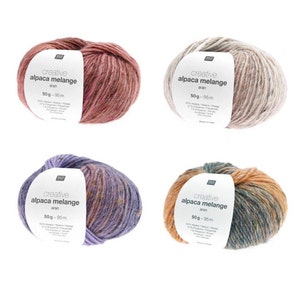May include: Four balls of alpaca blend yarn in different colour combinations. The yarn is labelled "creative alpaca melange aran" and has a weight of 50 grams and a length of 95 metres.