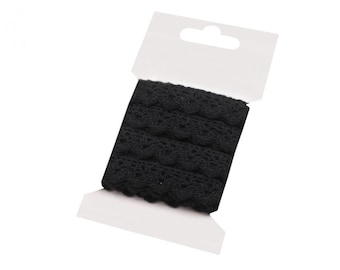 May include: Black lace trim ribbon on a white card. The ribbon is packaged and ready to be used for crafts or sewing projects.