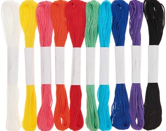 May include: Ten spools of embroidery floss in various colors, including white, yellow, pink, orange, red, green, blue, purple, and black.
