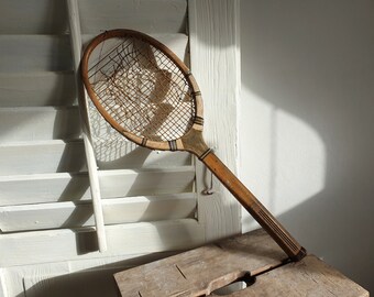 raqueta de madera antigua