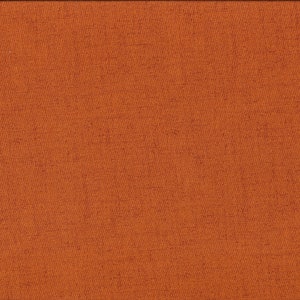 Könnte beinhalten: Nahaufnahme eines rostfarbenen Stoffes mit einem dezenten, strukturierten Muster. Der Stoff ist glatt und hat eine leicht raue Haptik.