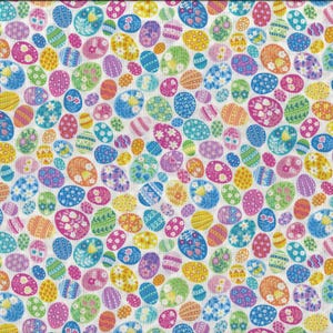 May include: A white fabric with a repeating pattern of colorful Easter eggs. The eggs are decorated with various designs, including flowers, stripes, and polka dots.
