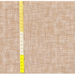 May include: A close-up of a beige fabric with a woven texture. A yellow ruler is visible on the left side of the image, measuring up to 53.3 cm.