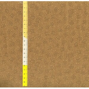 May include: A brown fabric with a repeating pattern of small, dark brown squares. The fabric is textured and has a subtle sheen. A yellow ruler is visible on the left side of the image.