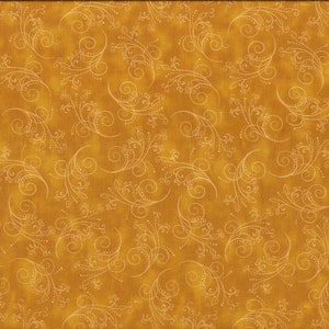 May include: A gold fabric with a white swirl pattern. The fabric has a subtle texture and a slightly faded look.