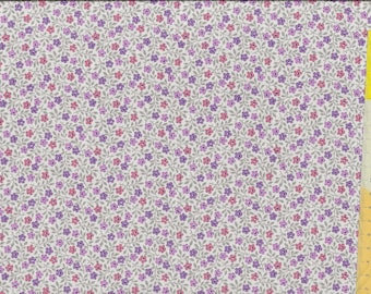 Patchwork fabric "Sweet Things" scattered flowers in purple and pink on a light background