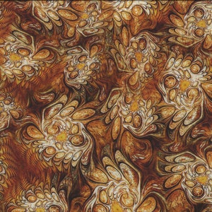 May include: Fabric with a swirling, abstract pattern in shades of brown, tan, and cream. The design features organic shapes resembling stylized flowers or leaves. A yellow ruler is visible along the right edge, with measurements in inches.