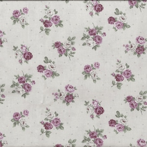 May include: White fabric with a repeating pattern of small purple and white floral bouquets. The fabric has a subtle dotted texture.