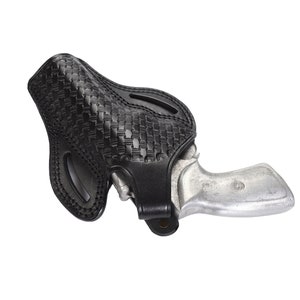 May include: A black leather holster with a woven pattern, designed to hold a small silver revolver.