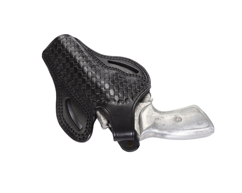 May include: A black leather holster with a woven pattern, designed to hold a small silver revolver.