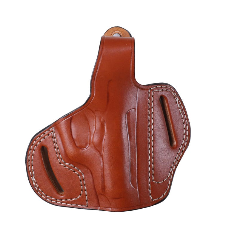 Handmade brown Right Hand leather OWB pancake holster by Pusat Holster, precision-molded for Beretta 84, 84BB, 84F, and 84FS Cheetah .380 ACP models. The image highlights the 100% premium genuine leather texture, hand-polished edges, and heavy-duty stitching on a white background. Features a secure thumb break with durable brass snaps and 304 stainless steel hardware. Designed for a perfect, rattle-free fit, offering a blend of classic style and tactical durability for daily carry.