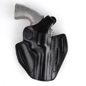 Colt Python 4.25 inch leather holster with 3-slot belt loop for vertical or angled carry, thumb break security, premium brown cowhide.