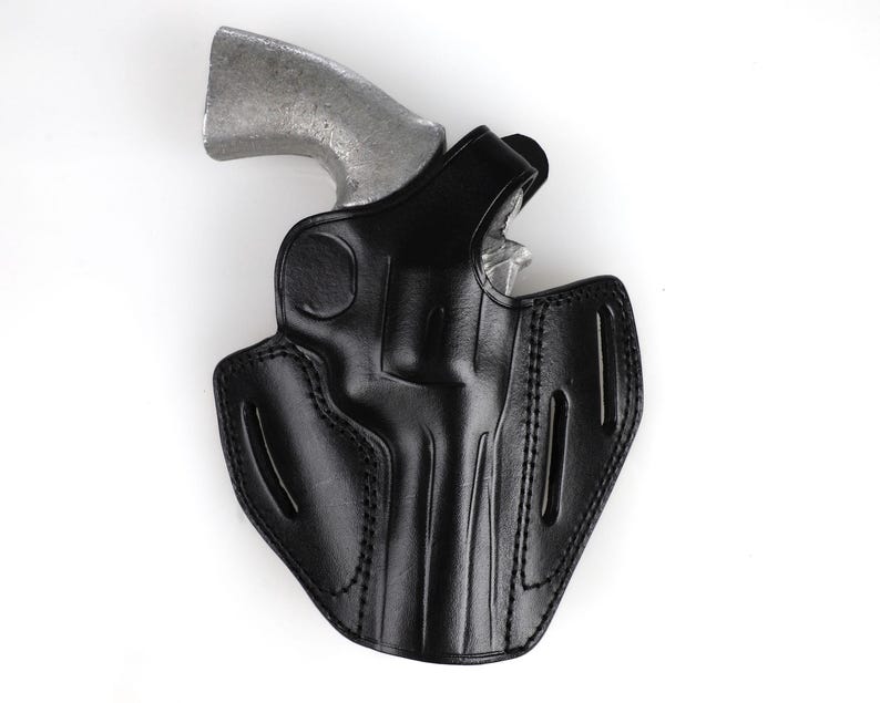 Colt Python 4.25 inch leather holster with 3-slot belt loop for vertical or angled carry, thumb break security, premium brown cowhide.