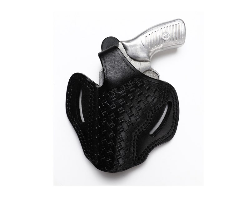 May include: A black leather holster with a woven pattern for a silver handgun.