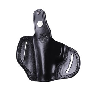 Handmade Black Right Hand leather OWB pancake holster by Pusat Holster, precision-molded for Beretta 84, 84BB, 84F, and 84FS Cheetah .380 ACP models. The image highlights the 100% premium genuine leather texture, hand-polished edges, and heavy-duty stitching on a white background. Features a secure thumb break with durable brass snaps and 304 stainless steel hardware. Designed for a perfect, rattle-free fit, offering a blend of classic style and tactical durability for daily carry.