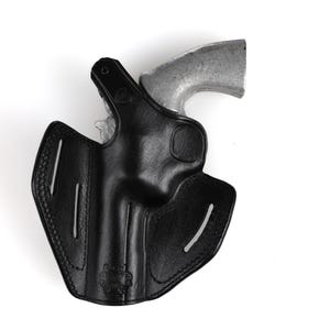 Colt Python 4.25 inch leather holster with 3-slot belt loop for vertical or angled carry, thumb break security, premium brown cowhide.