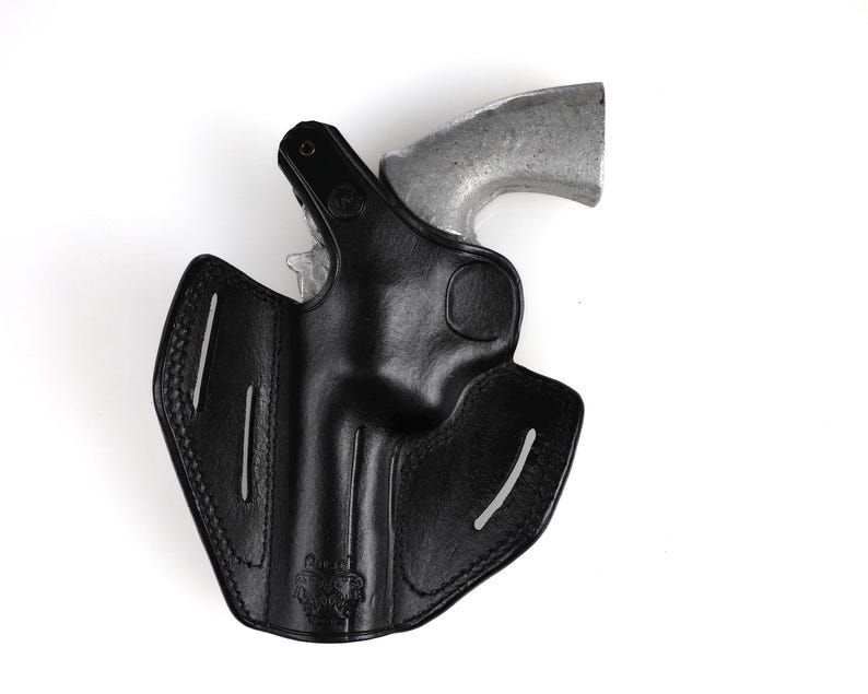 Colt Python 4.25 inch leather holster with 3-slot belt loop for vertical or angled carry, thumb break security, premium brown cowhide.