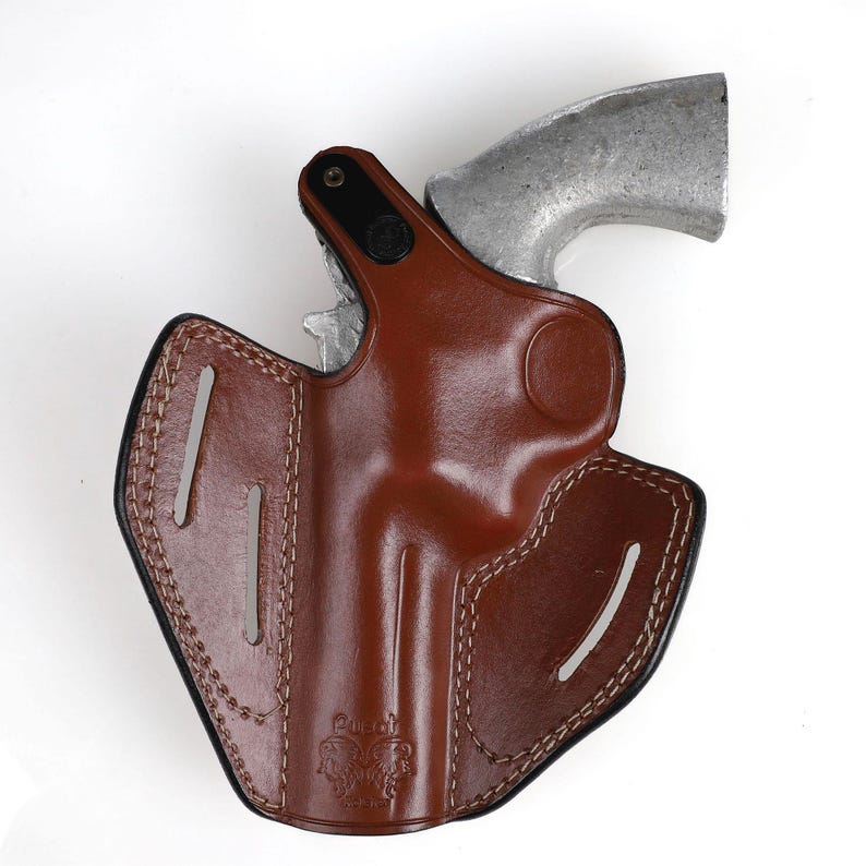 Colt Python 4.25 inch leather holster with 3-slot belt loop for vertical or angled carry, thumb break security, premium brown cowhide.