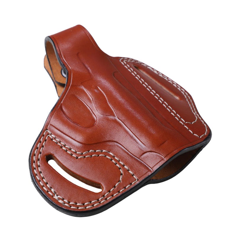 Handmade brown Right Hand leather OWB pancake holster by Pusat Holster, precision-molded for Beretta 84, 84BB, 84F, and 84FS Cheetah .380 ACP models. The image highlights the 100% premium genuine leather texture, hand-polished edges, and heavy-duty stitching on a white background. Features a secure thumb break with durable brass snaps and 304 stainless steel hardware. Designed for a perfect, rattle-free fit, offering a blend of classic style and tactical durability for daily carry.