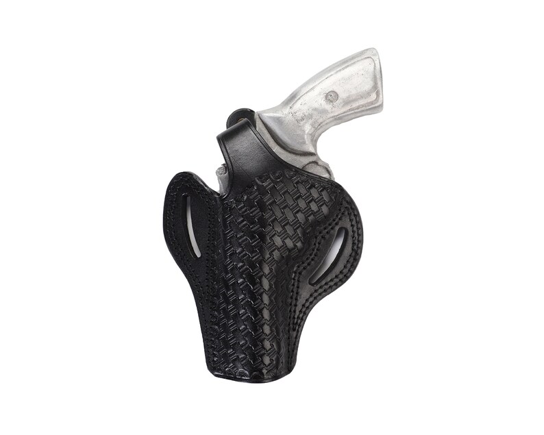 May include: A black leather holster with a woven pattern for a silver handgun.
