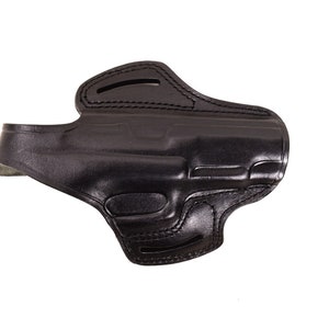 May include: A black leather holster for a handgun. The holster has a belt loop and a snap closure.