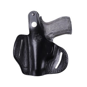 Handmade Black Right Hand leather OWB pancake holster by Pusat Holster, precision-molded for Beretta 84, 84BB, 84F, and 84FS Cheetah .380 ACP models. The image highlights the 100% premium genuine leather texture, hand-polished edges, and heavy-duty stitching on a white background. Features a secure thumb break with durable brass snaps and 304 stainless steel hardware. Designed for a perfect, rattle-free fit, offering a blend of classic style and tactical durability for daily carry.