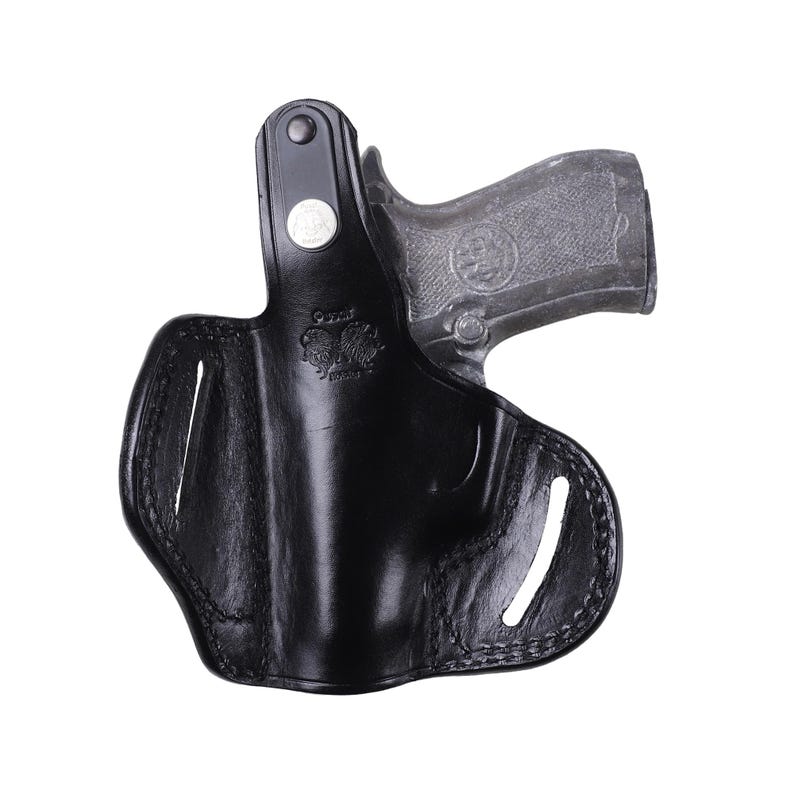 Handmade Black Right Hand leather OWB pancake holster by Pusat Holster, precision-molded for Beretta 84, 84BB, 84F, and 84FS Cheetah .380 ACP models. The image highlights the 100% premium genuine leather texture, hand-polished edges, and heavy-duty stitching on a white background. Features a secure thumb break with durable brass snaps and 304 stainless steel hardware. Designed for a perfect, rattle-free fit, offering a blend of classic style and tactical durability for daily carry.