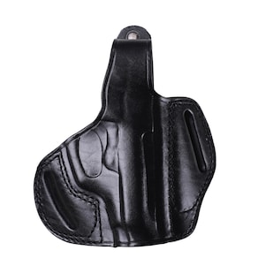 Handmade Black Right Hand leather OWB pancake holster by Pusat Holster, precision-molded for Beretta 84, 84BB, 84F, and 84FS Cheetah .380 ACP models. The image highlights the 100% premium genuine leather texture, hand-polished edges, and heavy-duty stitching on a white background. Features a secure thumb break with durable brass snaps and 304 stainless steel hardware. Designed for a perfect, rattle-free fit, offering a blend of classic style and tactical durability for daily carry.