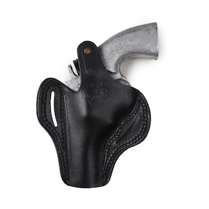 May include: A black leather holster with a stitched design. The holster is designed to hold a small silver revolver.