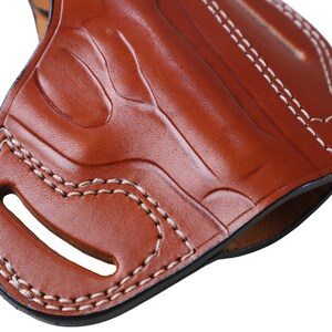 Handmade brown Right Hand leather OWB pancake holster by Pusat Holster, precision-molded for Beretta 84, 84BB, 84F, and 84FS Cheetah .380 ACP models. The image highlights the 100% premium genuine leather texture, hand-polished edges, and heavy-duty stitching on a white background. Features a secure thumb break with durable brass snaps and 304 stainless steel hardware. Designed for a perfect, rattle-free fit, offering a blend of classic style and tactical durability for daily carry.