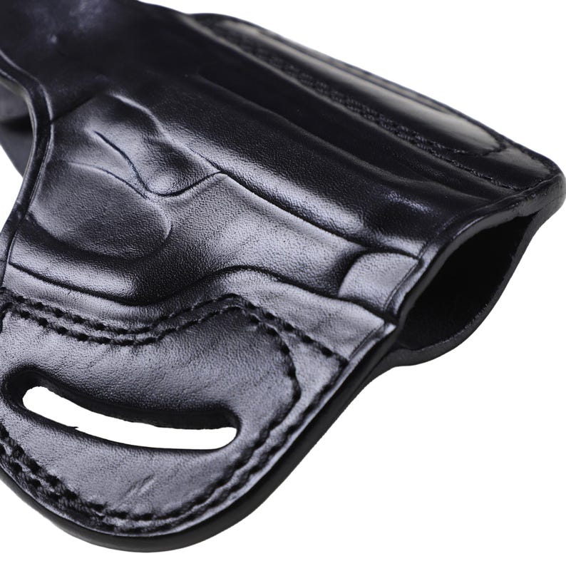 Handmade Black Right Hand leather OWB pancake holster by Pusat Holster, precision-molded for Beretta 84, 84BB, 84F, and 84FS Cheetah .380 ACP models. The image highlights the 100% premium genuine leather texture, hand-polished edges, and heavy-duty stitching on a white background. Features a secure thumb break with durable brass snaps and 304 stainless steel hardware. Designed for a perfect, rattle-free fit, offering a blend of classic style and tactical durability for daily carry.