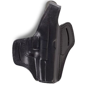 May include: Black leather holster with a molded design. Features a belt loop and a contoured shape for secure firearm carry. The holster is designed for right-handed use and is made of durable leather.