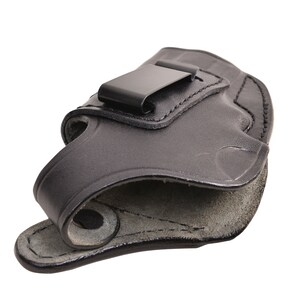May include: Black leather holster with a metal clip. The holster is designed to be worn on the inside of the waistband. The interior is a lighter shade of gray. The holster is made of a durable material.