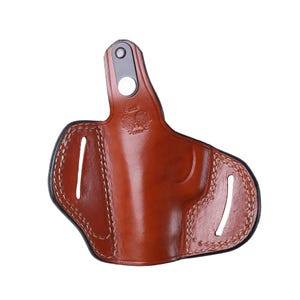 Handmade brown Right Hand leather OWB pancake holster by Pusat Holster, precision-molded for Beretta 84, 84BB, 84F, and 84FS Cheetah .380 ACP models. The image highlights the 100% premium genuine leather texture, hand-polished edges, and heavy-duty stitching on a white background. Features a secure thumb break with durable brass snaps and 304 stainless steel hardware. Designed for a perfect, rattle-free fit, offering a blend of classic style and tactical durability for daily carry.