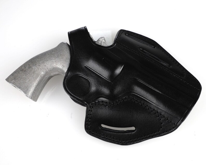 Colt Python 4.25 inch leather holster with 3-slot belt loop for vertical or angled carry, thumb break security, premium brown cowhide.