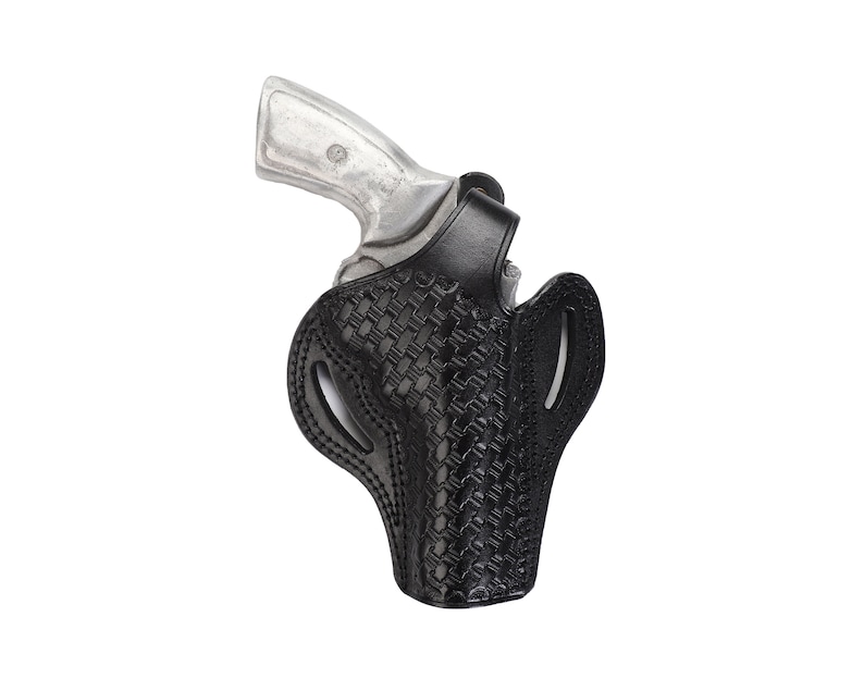 May include: A black leather holster with a woven pattern for a silver handgun.