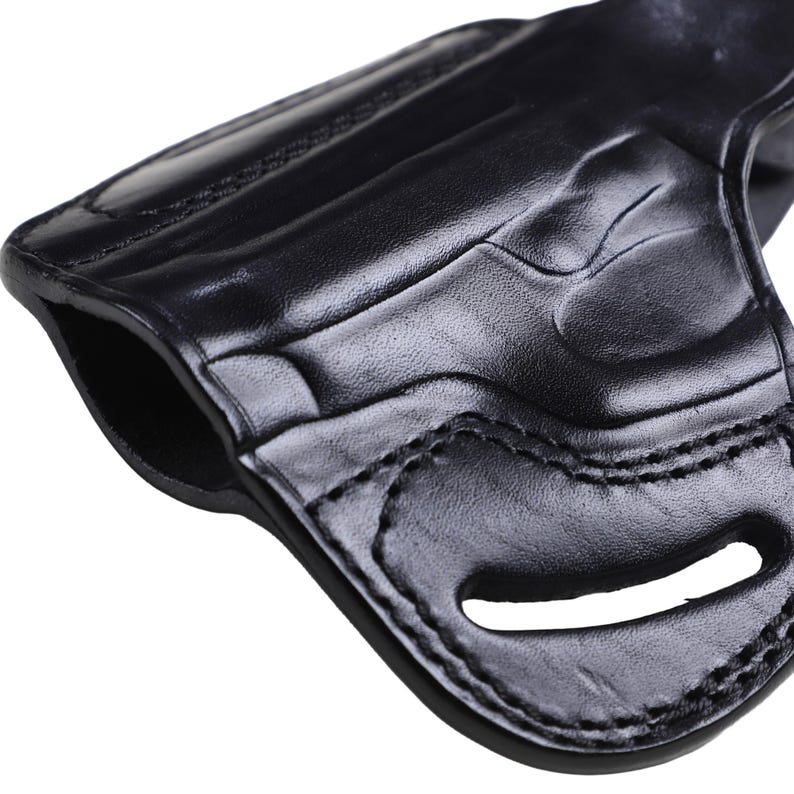 Handmade Black Left Hand leather OWB pancake holster by Pusat Holster, precision-molded for Beretta 84, 84BB, 84F, and 84FS Cheetah .380 ACP models. The image highlights the 100% premium genuine leather texture, hand-polished edges, and heavy-duty stitching on a white background. Features a secure thumb break with durable brass snaps and 304 stainless steel hardware. Designed for a perfect, rattle-free fit, offering a blend of classic style and tactical durability for daily carry.