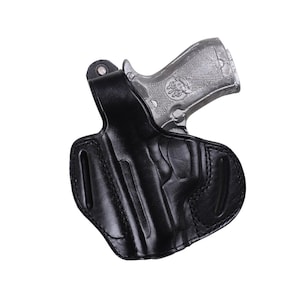 Handmade Black Left Hand leather OWB pancake holster by Pusat Holster, precision-molded for Beretta 84, 84BB, 84F, and 84FS Cheetah .380 ACP models. The image highlights the 100% premium genuine leather texture, hand-polished edges, and heavy-duty stitching on a white background. Features a secure thumb break with durable brass snaps and 304 stainless steel hardware. Designed for a perfect, rattle-free fit, offering a blend of classic style and tactical durability for daily carry.