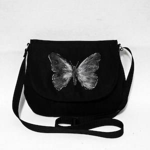 Messenger bag painted with a butterfly image 1