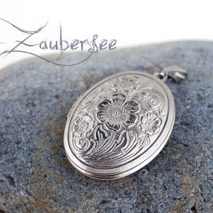 Stainless steel medallion, oval silver-colored amulet